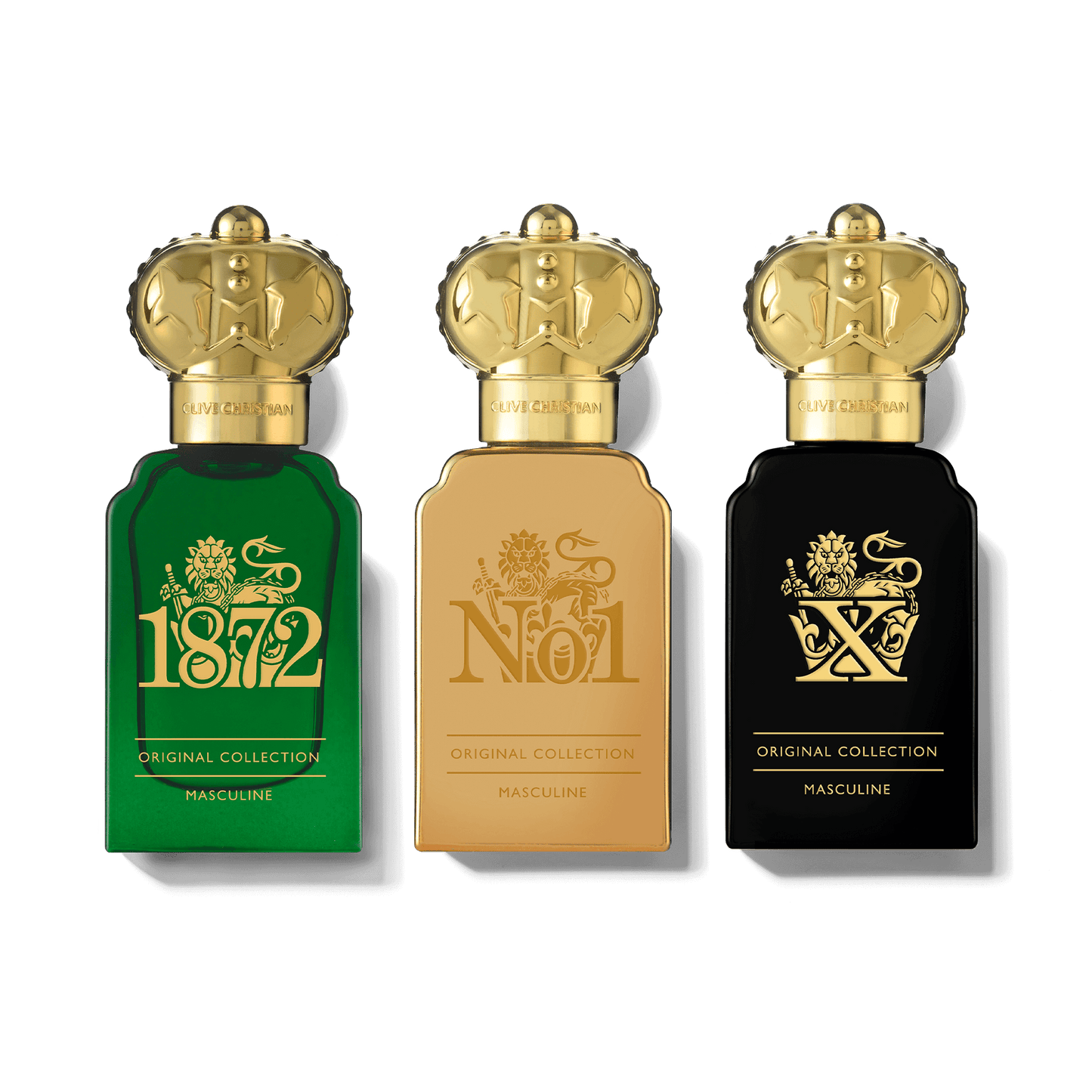 Three bottles of Clive Christian men's cologne stand in a row, each featuring a gold crown cap and distinct bottle designs for 1872, No. 1, and X fragrances.